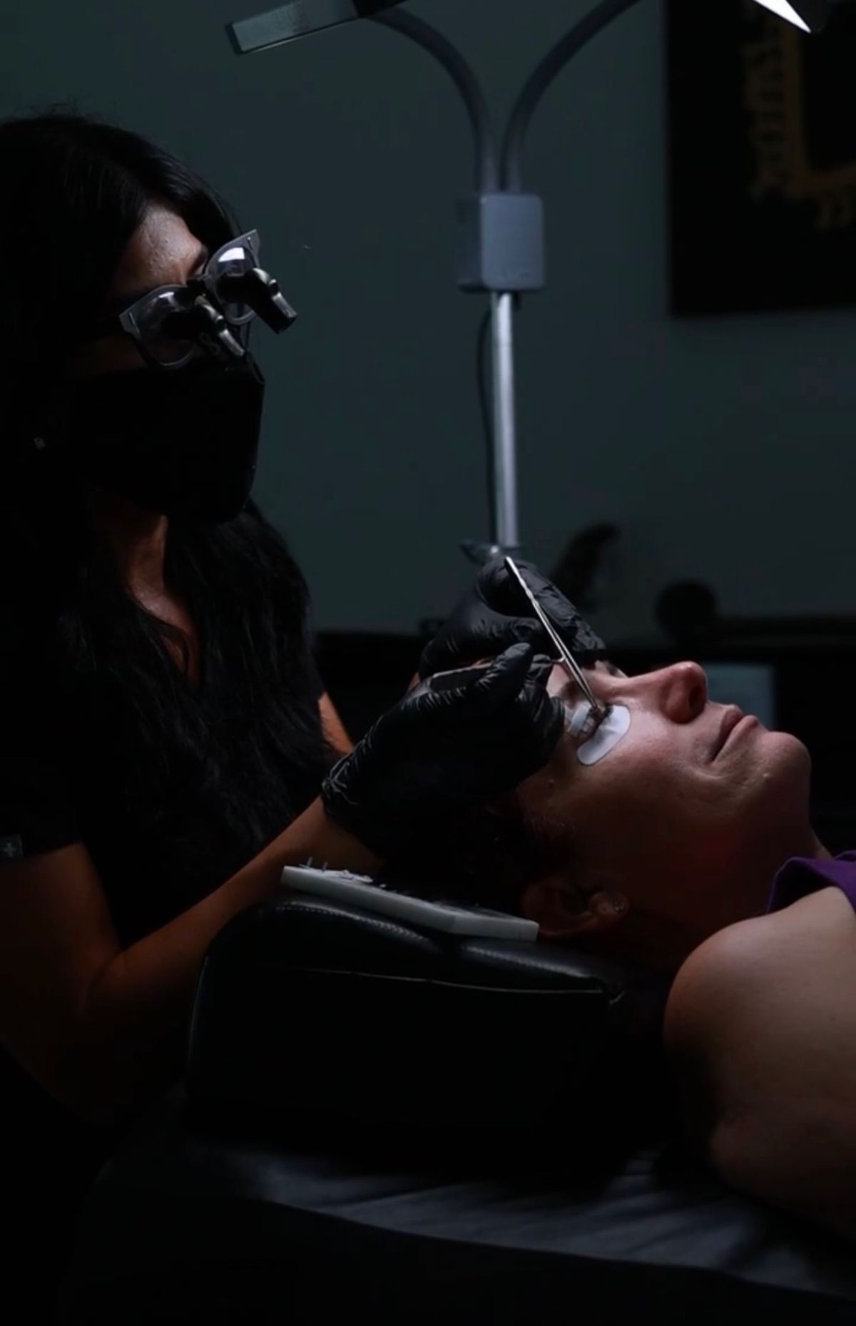 Jenna applying lash extensions in studio